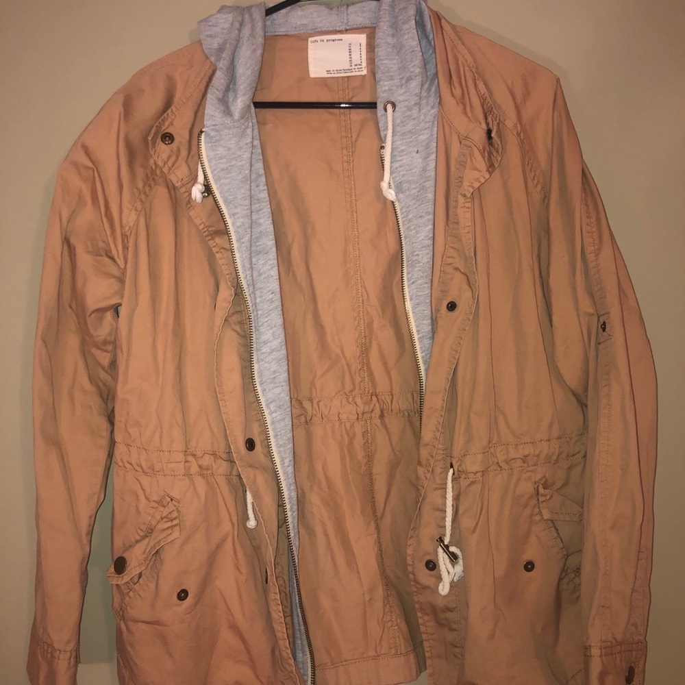 Tan jacket with grey hoodie